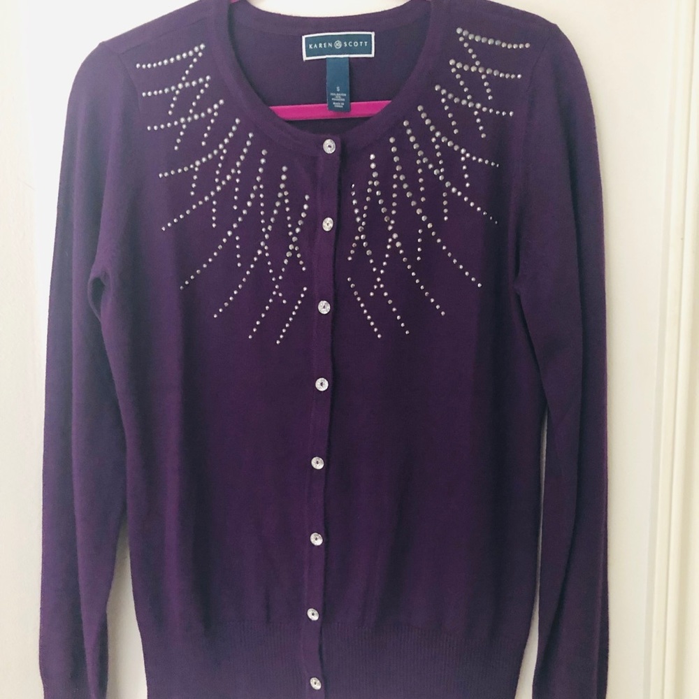 Embellished purple cardigan.